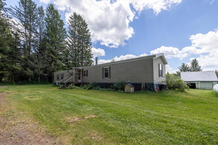 Set on nearly 25 acres along the scenic Deerskin River in Phelps - photo 24