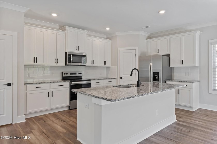 The Camden is a thoughtfully designed two-story home featuring - photo 5
