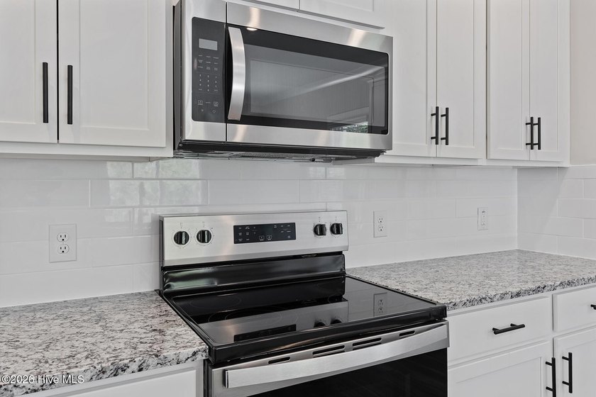 The Camden is a thoughtfully designed two-story home featuring - photo 8