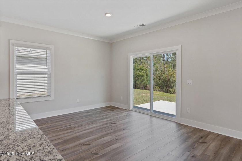 The Camden is a thoughtfully designed two-story home featuring - photo 9