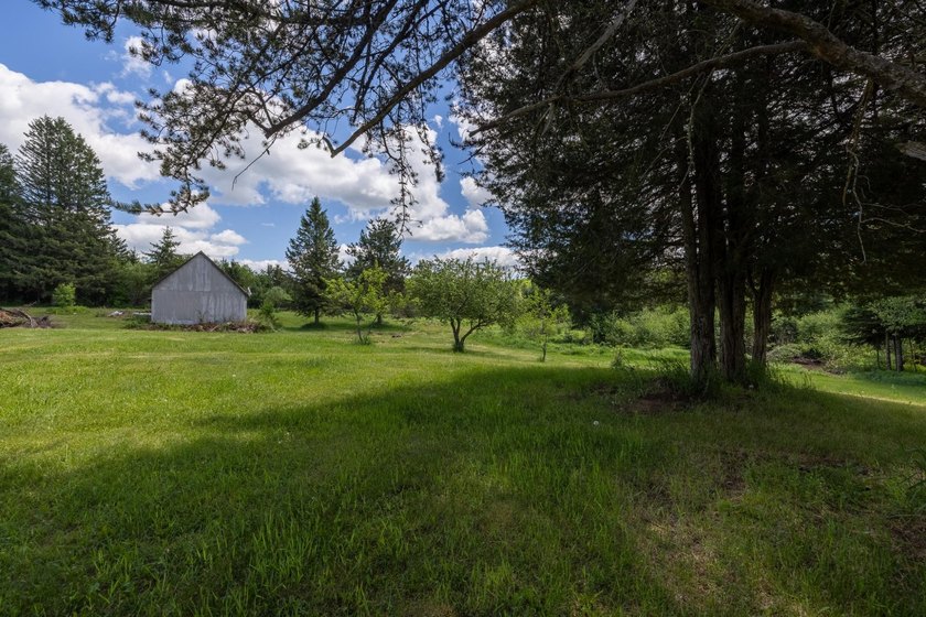 Set on nearly 25 acres along the scenic Deerskin River in Phelps - photo 36