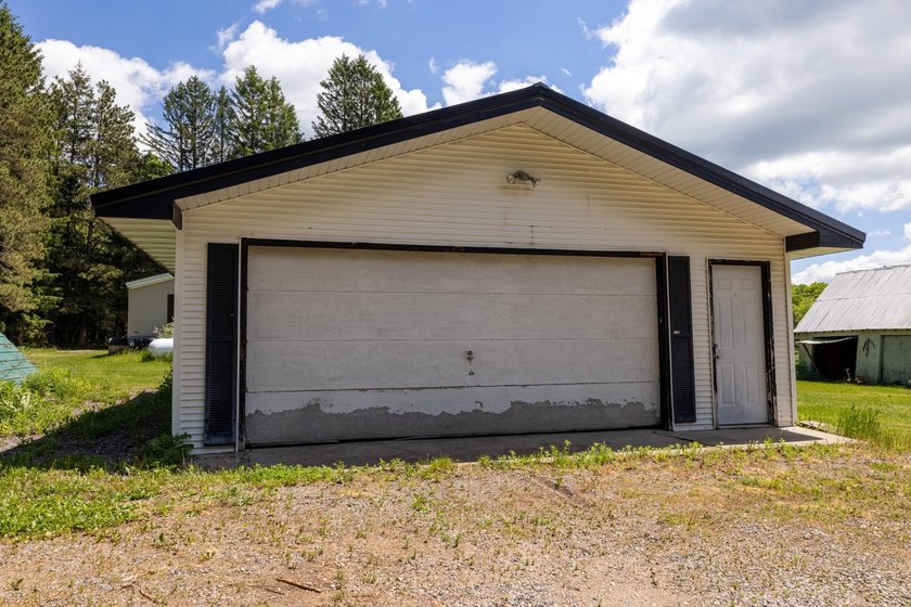 Set on nearly 25 acres along the scenic Deerskin River in Phelps - photo 38