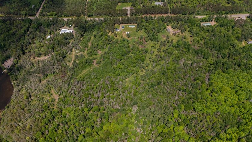 Set on nearly 25 acres along the scenic Deerskin River in Phelps - photo 40