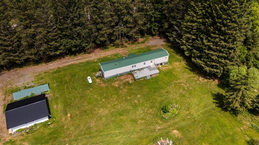 Set on nearly 25 acres along the scenic Deerskin River in Phelps - photo 42