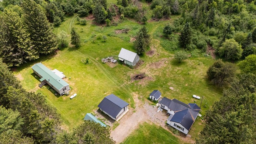 Set on nearly 25 acres along the scenic Deerskin River in Phelps - photo 44