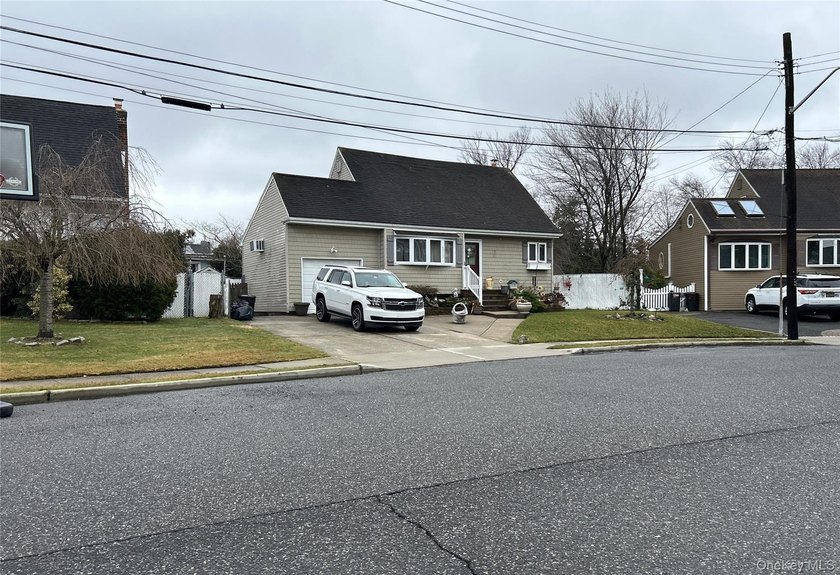 Cape style home. This home features 4 bedrooms, 2 full baths, an - photo 2