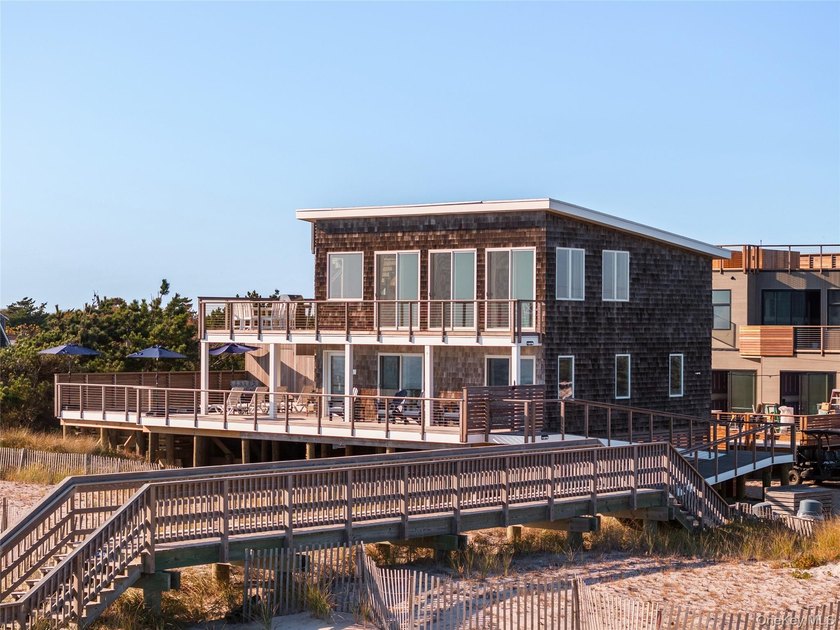Introducing a rare oceanfront masterpiece in the coveted enclave - photo 3