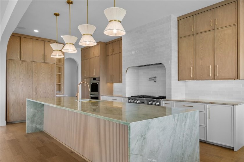 Experience extraordinary waterfront living in this stunning new - photo 8