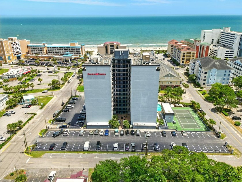 Welcome to Holiday Tower, where coastal convenience and a - photo 36