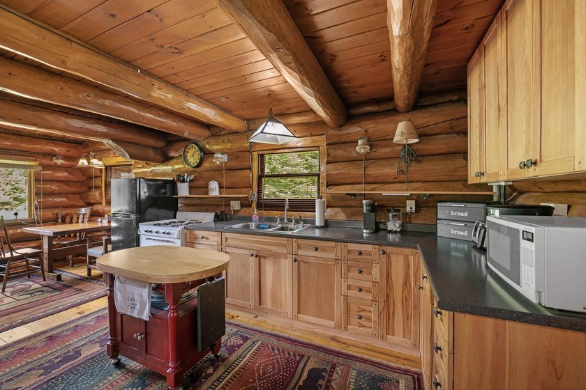 Unique in every way! This spectacular handcrafted full-log home - photo 29