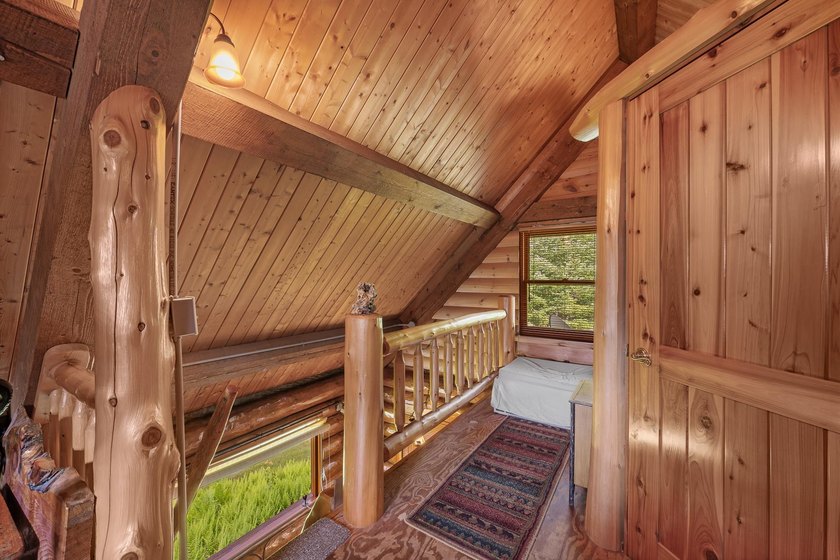 Unique in every way! This spectacular handcrafted full-log home - photo 47