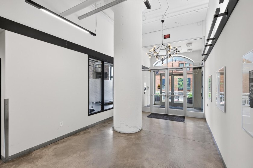 Rare 5th-floor corner loft at American Trio Lofts, filled with - photo 29