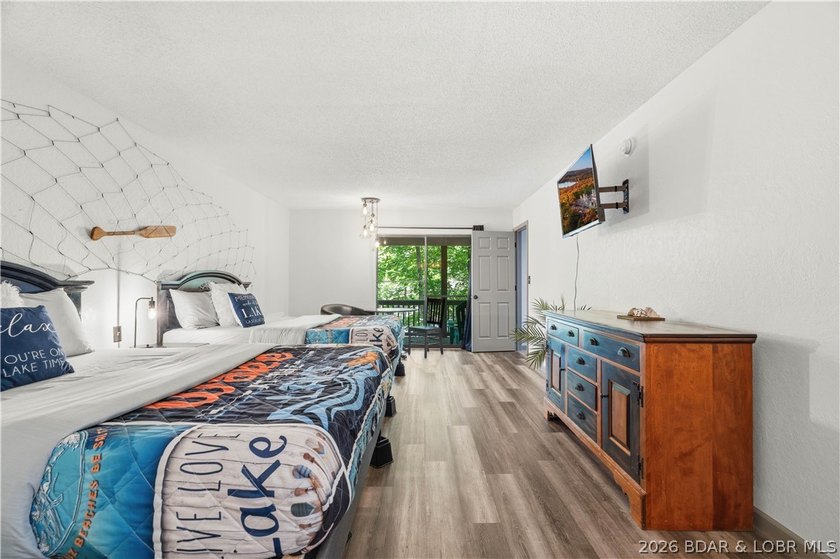 Tucked among the trees in the sought-after Tan-Tar-A Estates - photo 31