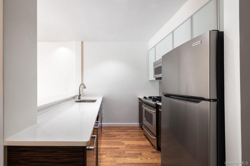 Welcome to Residence 1B, a bright and expansive duplex offering - photo 3