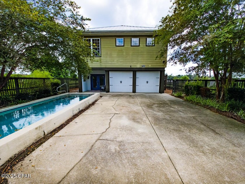 Custom-built in 2004 on 9' pilings with 4' of fill, this 2,172 - photo 8
