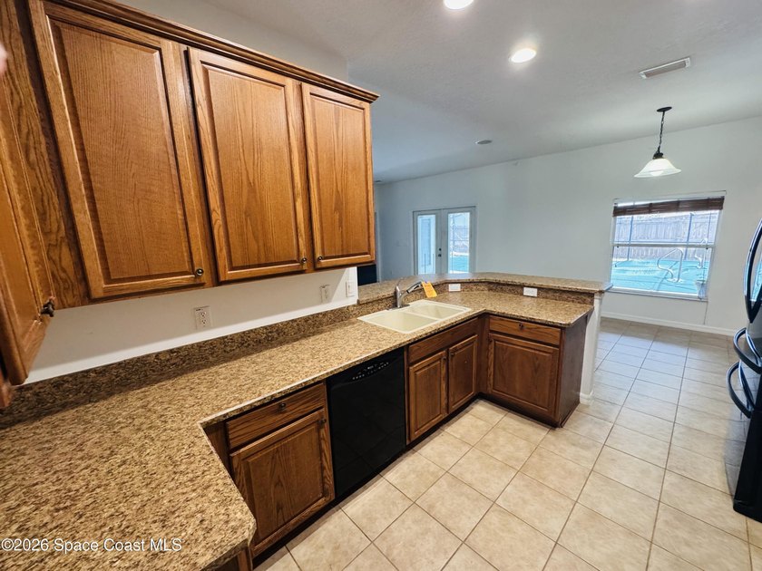 Spacious 4BR/3BA pool home with over 2,300 sq. ft. and a 3-car - photo 7