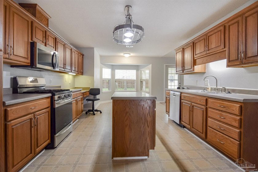 This well-maintained brick single-family home offers a - photo 3