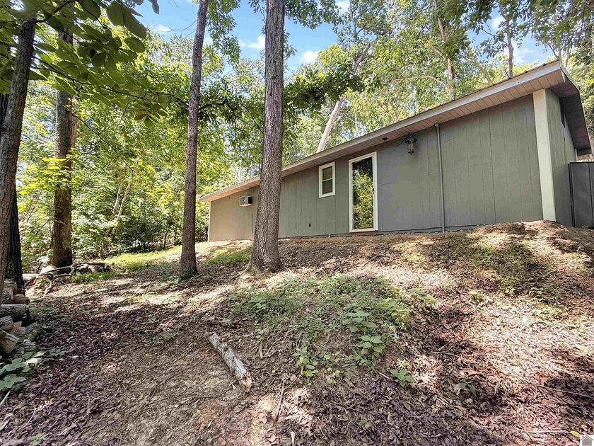 SECLUDED! Tucked away on 1.75 wooded acres, this cute 3-bedroom - photo 13