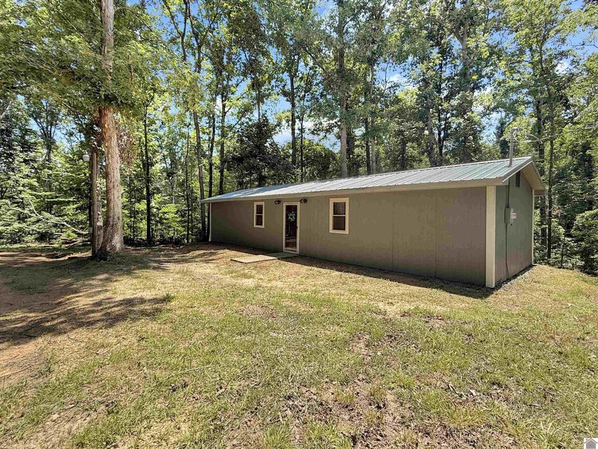 SECLUDED! Tucked away on 1.75 wooded acres, this cute 3-bedroom - photo 15