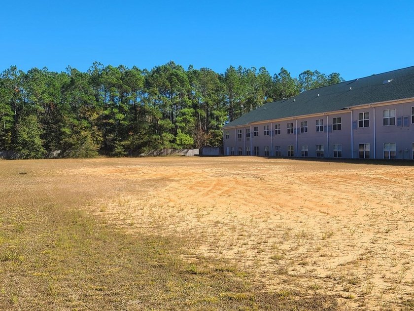 PERFECT LOCATION! THIS PRIME COMMERCIAL PROPERTY IS DIRECTLY OFF - photo 7