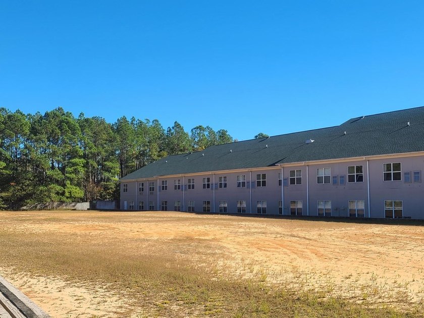 PERFECT LOCATION! THIS PRIME COMMERCIAL PROPERTY IS DIRECTLY OFF - photo 9