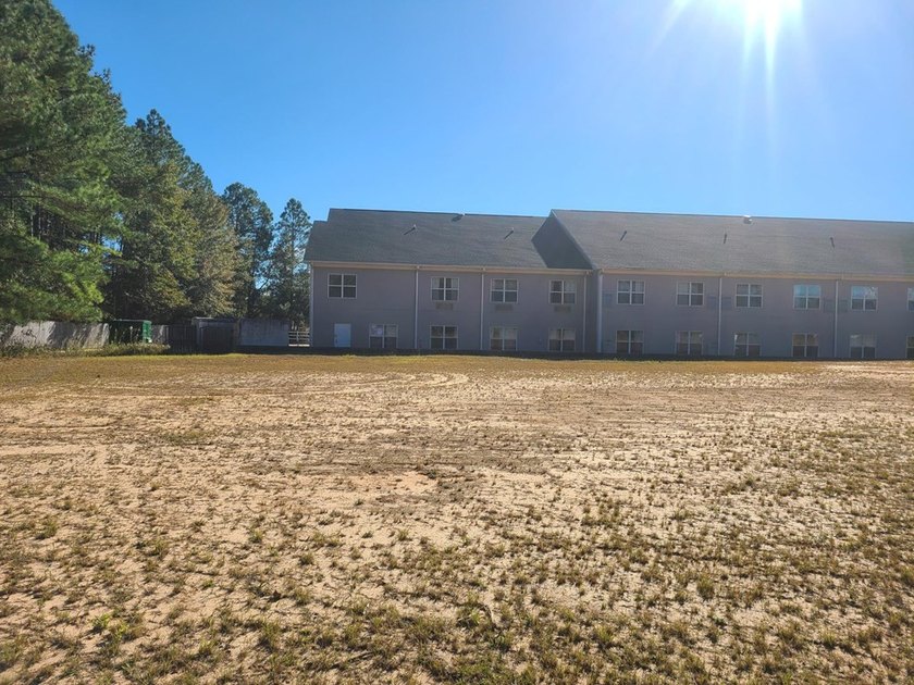 PERFECT LOCATION! THIS PRIME COMMERCIAL PROPERTY IS DIRECTLY OFF - photo 10