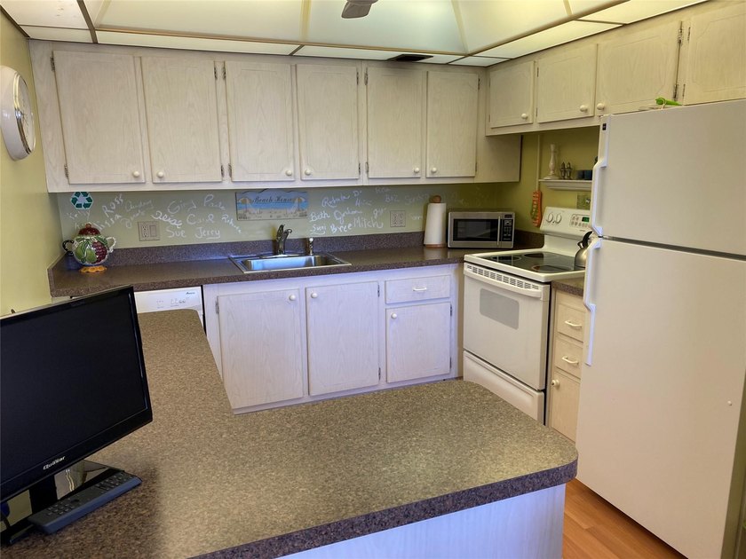WATER VIEW ! FROM THIS 2ND FLOOR, MOVE IN READY UNIT. FULLY - photo 6