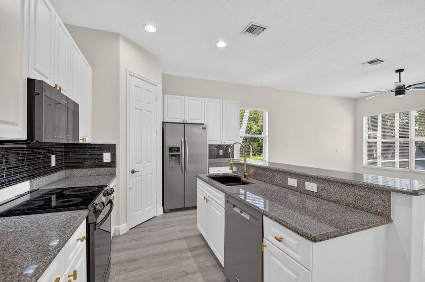 Welcome to this pristine, single-story pool home zoned for - photo 17