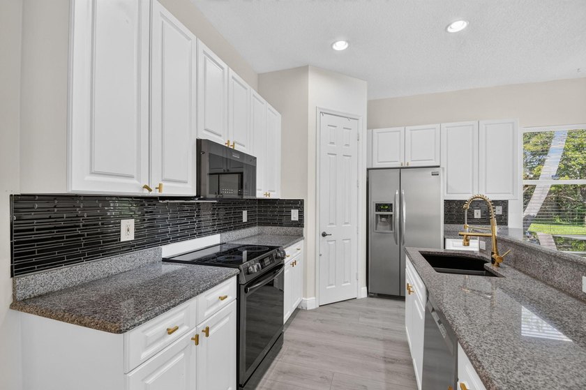 Welcome to this pristine, single-story pool home zoned for - photo 18
