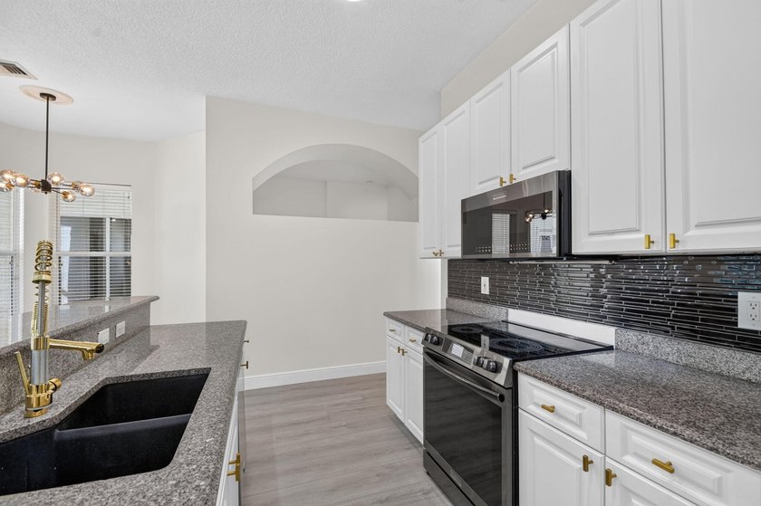 Welcome to this pristine, single-story pool home zoned for - photo 19