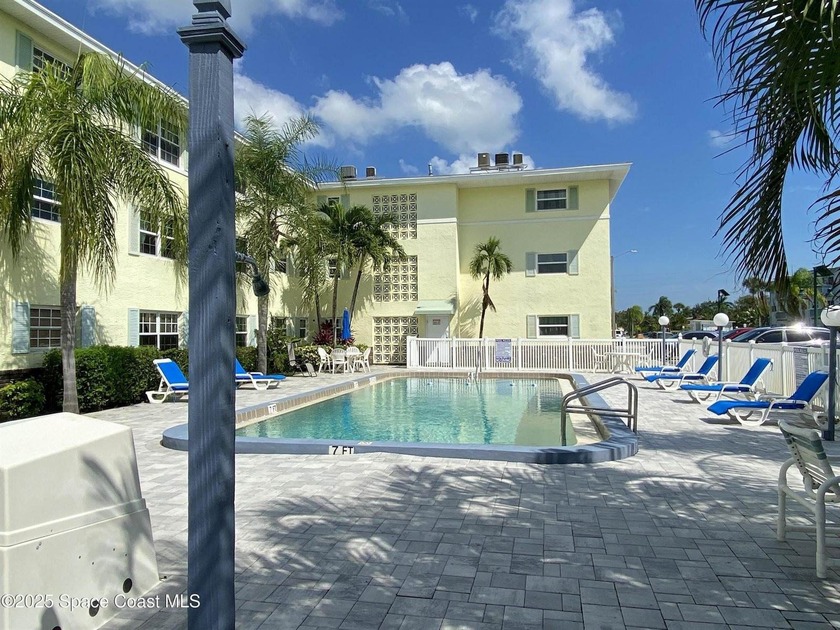 This charming top floor end unit overlooking the sparkling pool - photo 15