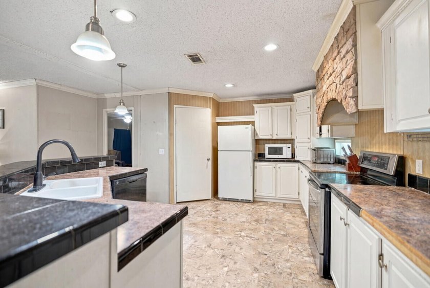 This spacious 3-bedroom, 2-bathroom home offers a bright - photo 11