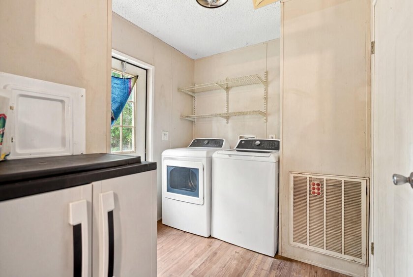 This spacious 3-bedroom, 2-bathroom home offers a bright - photo 18