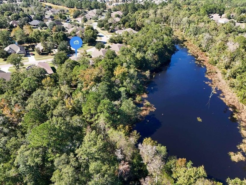 Experience luxurious pond-front living in this beautifully - photo 16