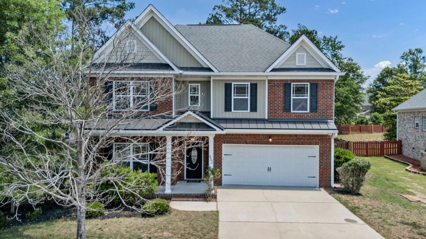 Stunning all brick home with exceptional curb appeal, featuring - photo 2