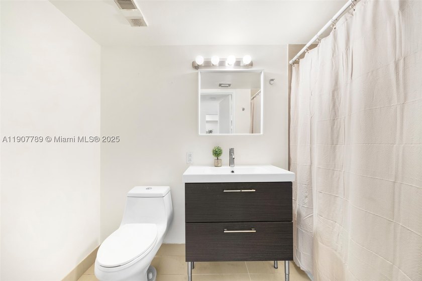 Sleek city living meets unmatched convenience in this updated - photo 15