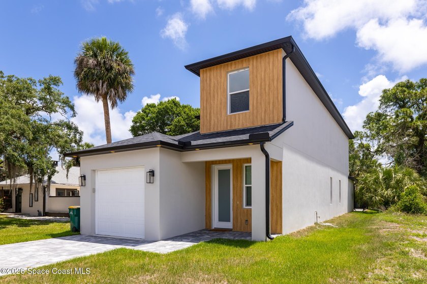 Experience modern luxury and effortless downtown living in this - photo 2