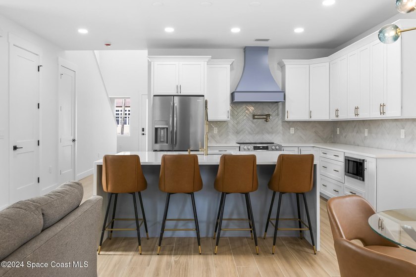 Experience modern luxury and effortless downtown living in this - photo 8