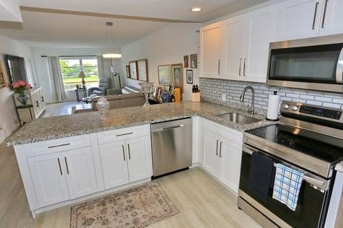 Beautifully well maintained condo by the owners. Great location - photo 19