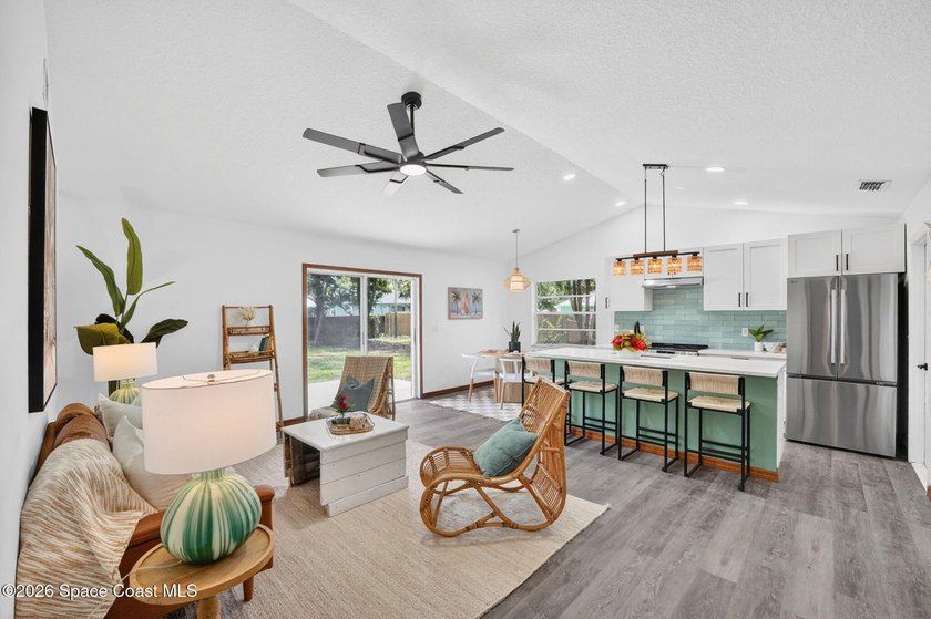 Set on an oversized .46-acre lot with mature trees, this - photo 3