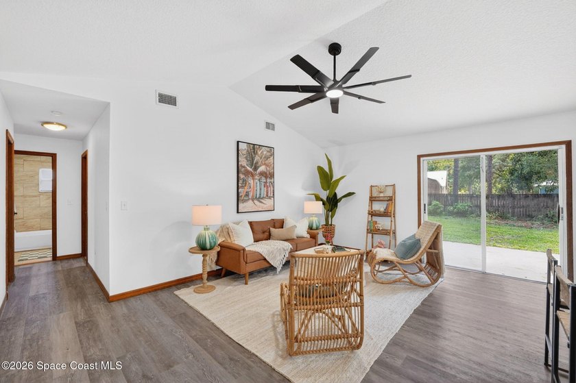 Set on an oversized .46-acre lot with mature trees, this - photo 6
