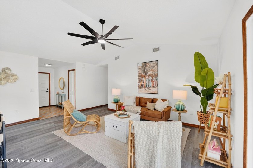 Set on an oversized .46-acre lot with mature trees, this - photo 8