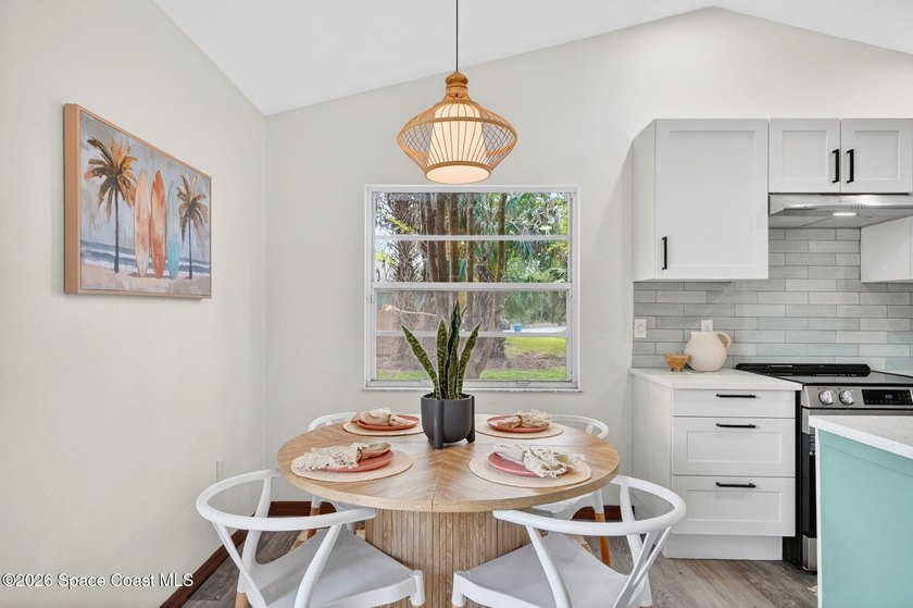 Set on an oversized .46-acre lot with mature trees, this - photo 10