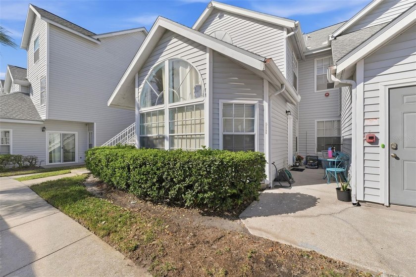 Welcome to this ground-floor, corner-unit condo that offers an - photo 2