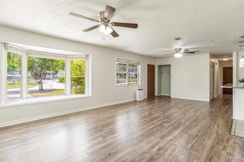 Step into the delightful 3-bedroom, 2-bath haven nestled in the - photo 9