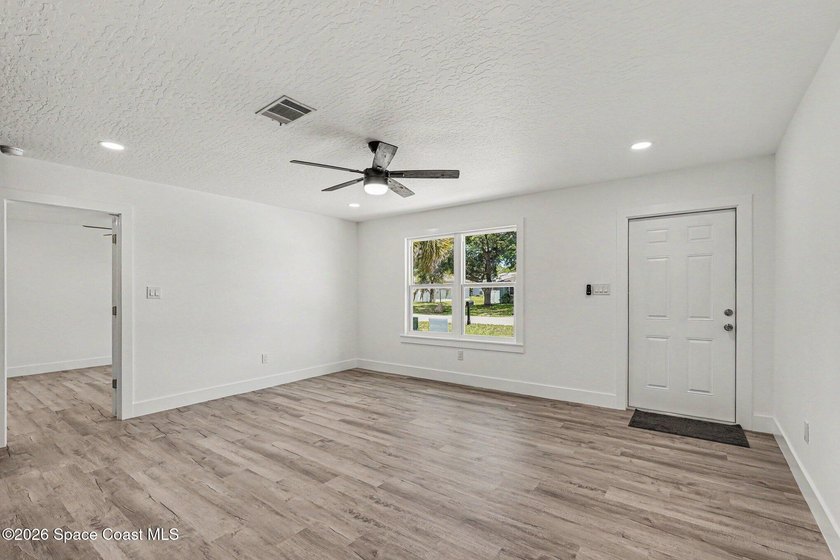 Completely updated 3-bedroom, 2-bath home with city water in the - photo 3