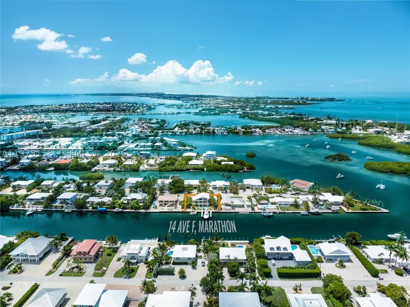 A rare waterfront estate along a 200-foot wide canal with a - photo 5