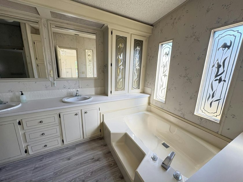 Bright and inviting corner-lot home featuring brand-new flooring - photo 11