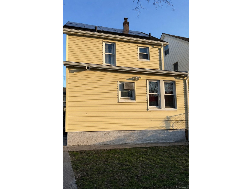 Welcome to a well-maintained two-family home offering - photo 4