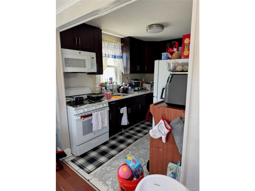 Welcome to a well-maintained two-family home offering - photo 7